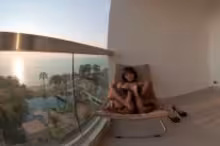 Namyvr in Cute Asian in Black Lace Lingerie Sways Hips on Oceanfront Balcony, photo 3 of 4